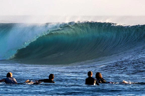 wSurfer braving the mixed left and right waves at Desperations, Fiji.