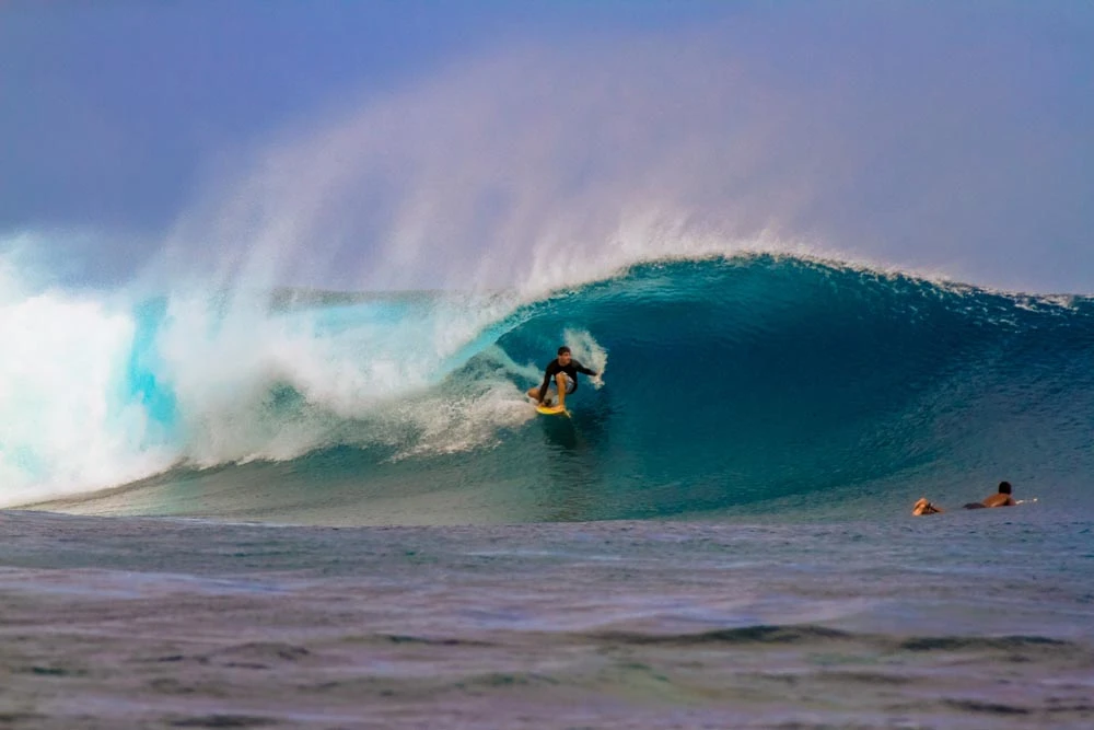 Expert surfer navigating the legendary waves at Frigates Passage, Fiji.