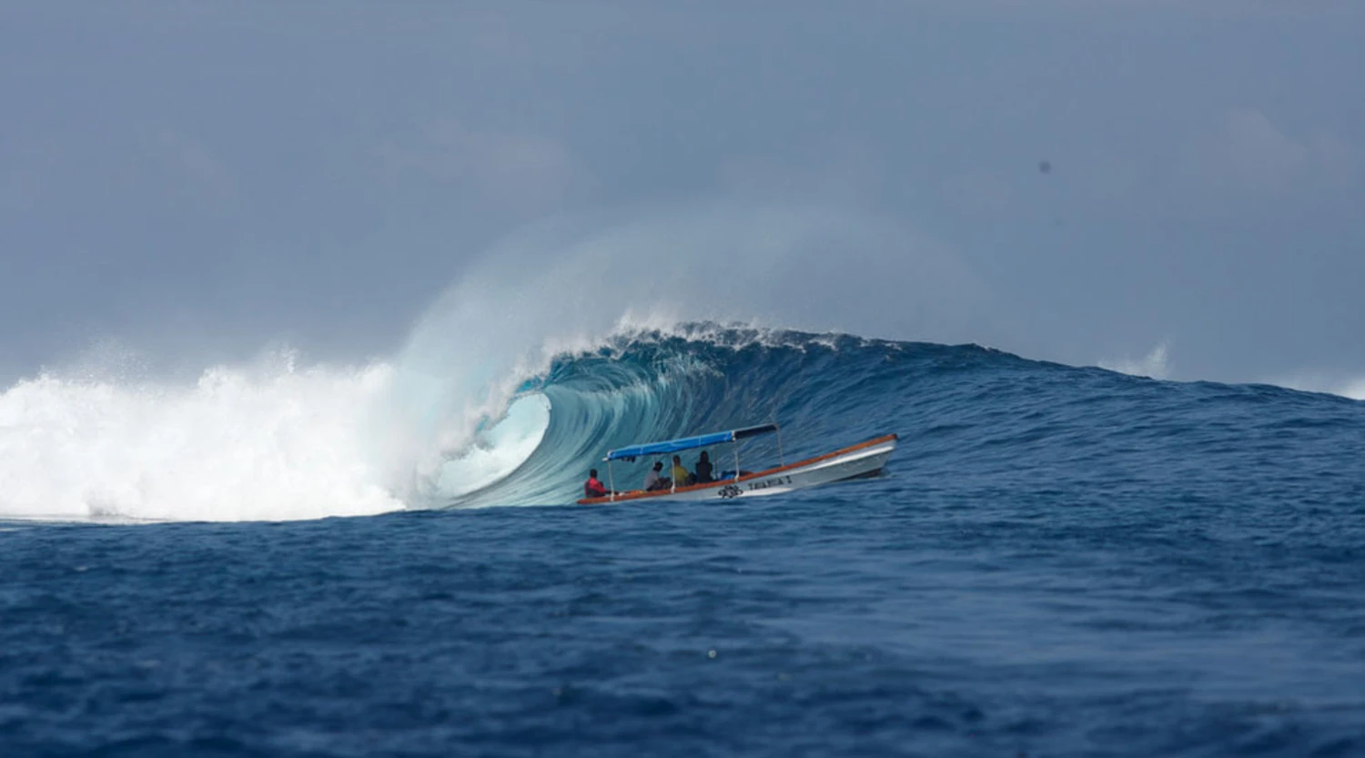 Thrilling left-hand waves at King Kong Left, near Namotu Island, Fiji.