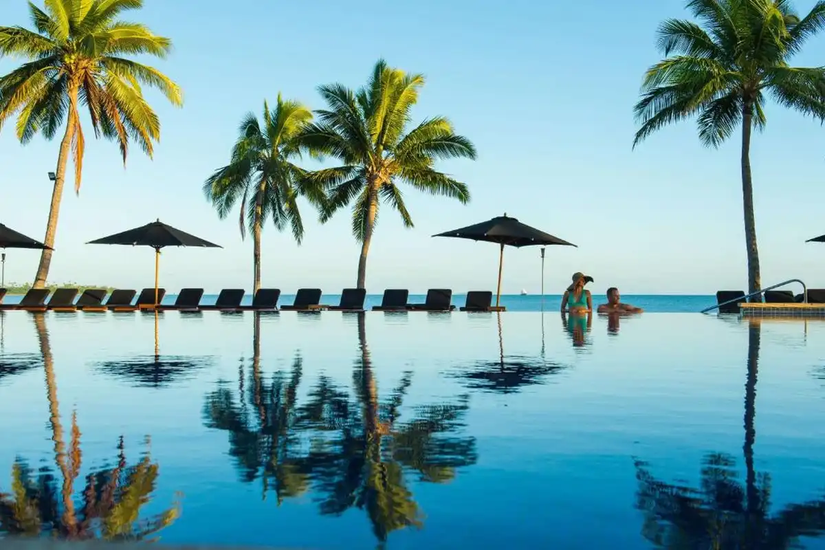 poolside view with couple in the distance