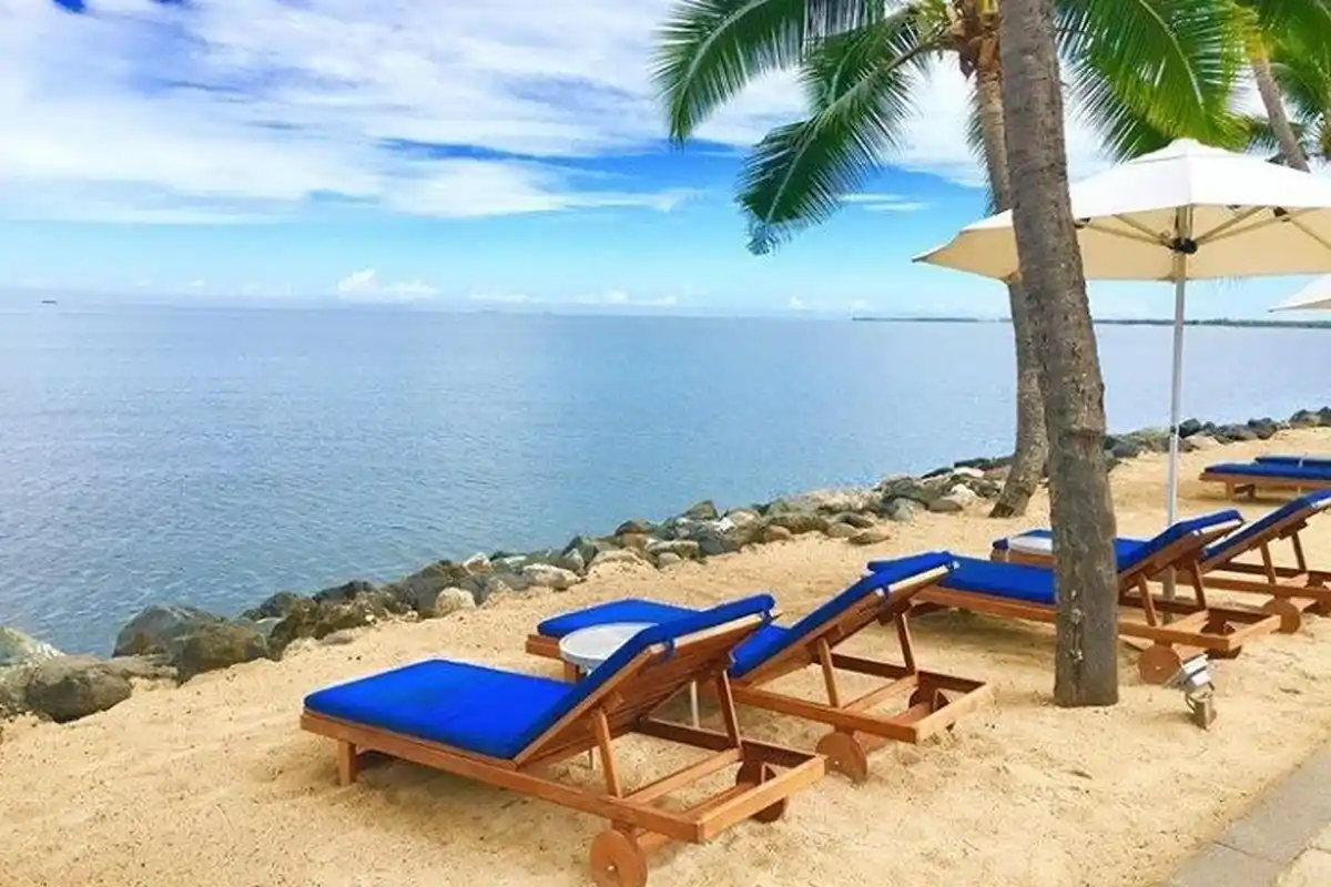 serene beach with umbrella and loungers for relaxing