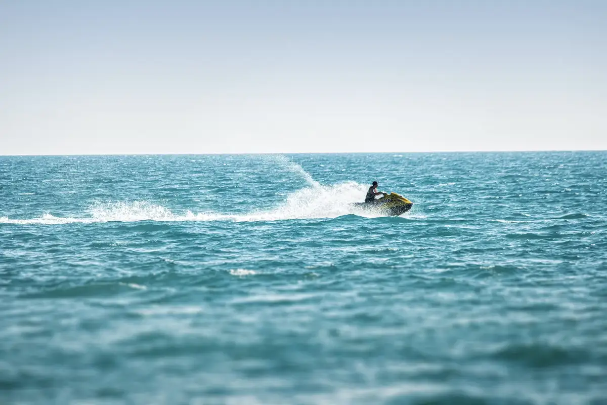 man racing on a jetski on fijian waters