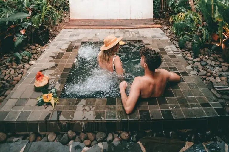 couple sharing a jacuzzi at gamea island resort fiji